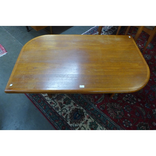 33 - A teak coffee table