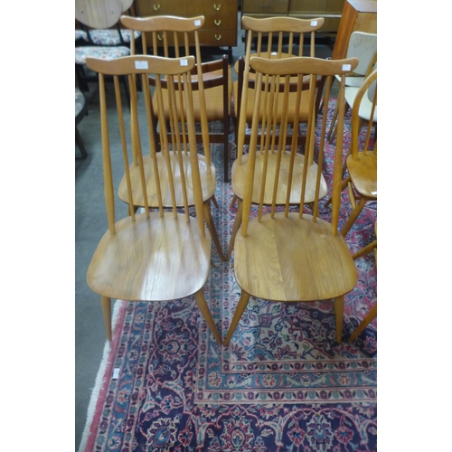 49 - A set of four Ercol Blonde elm and beech Goldsmith chairs