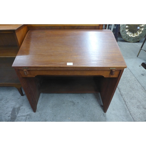 66 - A teak writing desk