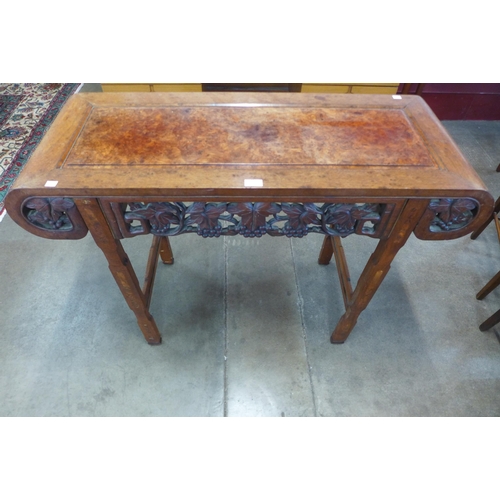 73 - An Eastern carved hardwood and burr elm alter table