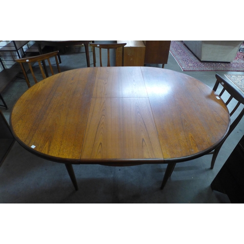 8 - A G-Plan Fresco teak extending dining table and four G-Plan Brasilia dining chairs