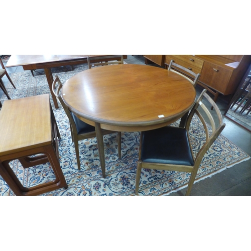 9 - A G-Plan Fresco teak extending dining table and four chairs