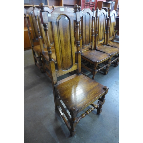 90 - A set of twelve Carolean style hardwood dining chairs