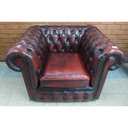 3 - An oxblood red leather club chair