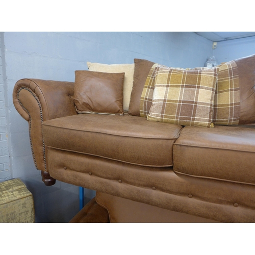 1425 - A County tan upholstered and studded three seater and loveseat * this lot is subject to VAT