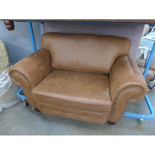 1425 - A County tan upholstered and studded three seater and loveseat * this lot is subject to VAT