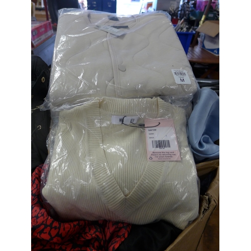 2049 - A large box of unused ladies clothing; coats, dresses, shirts and blouses