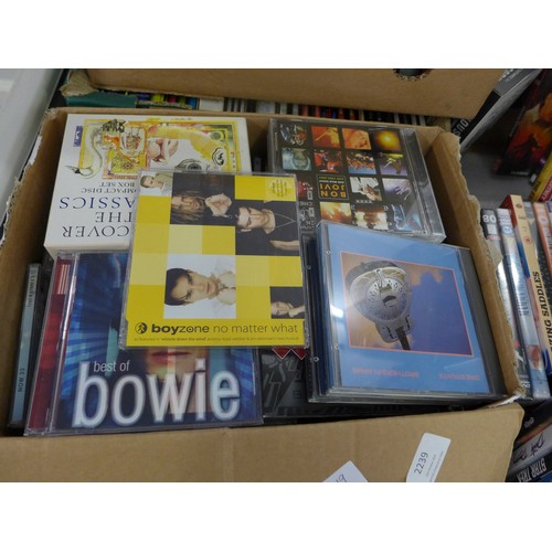 2239 - Two boxes of DVDs, VHS videos and CDs including Disney, pop and rock CDs, etc.