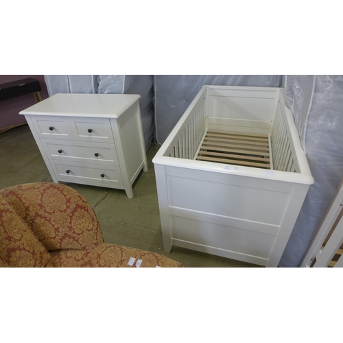 1561 - A white painted cot bed and chest of drawers