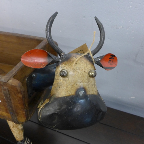 1324 - A recycled iron cow with a wooden flower planter, H 34cms x L49cms (MH616015)   #