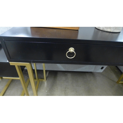 1372 - A black two drawer console table with gold legs