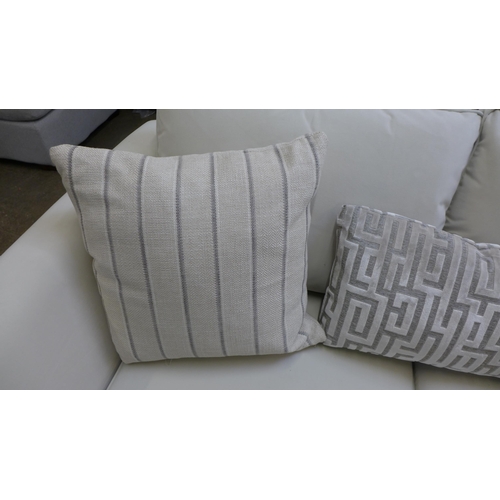 1462 - A Coconut velvet upholstered two seater sofa