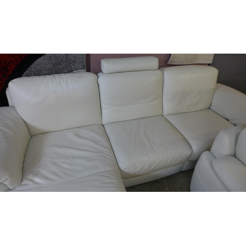 1486 - A Natuzzi cream two seater recliner and three seater sofa/chaise