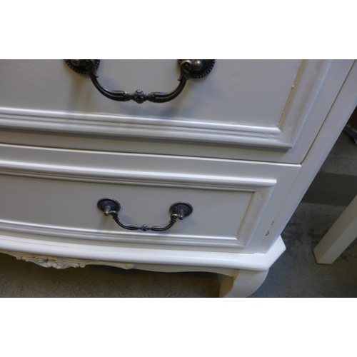 1542 - A white three drawer chest of drawers