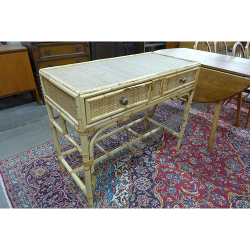 597 - A bamboo and rattan two drawer desk