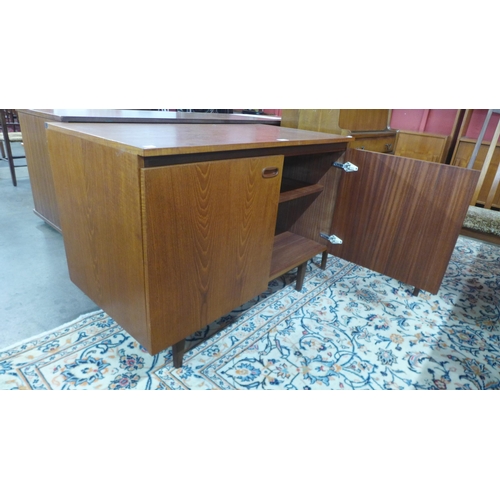 15 - A Danish teak fitted two door music cabinet