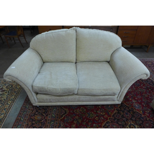 43 - A Duresta Harrington Hogarth two piece sand fabric lounge suite, comprising three seater settee and ... 