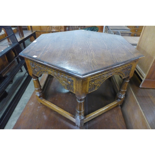 129 - A carved Ipswich oak octagonal coffee table