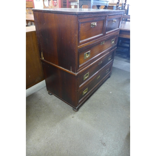 139 - A campaign style teak and brass mounted chest of drawers