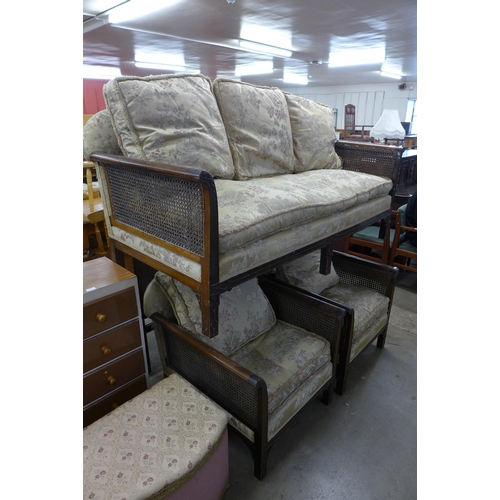 226 - An early 20th Century Chippendale Revival carved mahogany three piece bergere suite