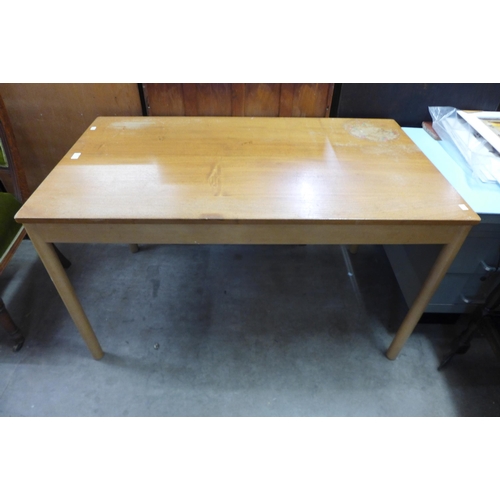 238 - An Ercol Blonde ash and beech dining table