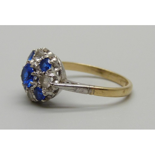 1022 - A 9ct gold ring set with blue and white stones, 2.5g, N