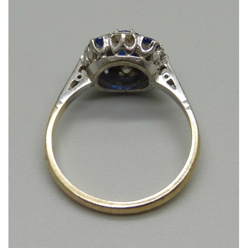 1022 - A 9ct gold ring set with blue and white stones, 2.5g, N