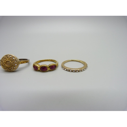 1031 - Three silver rings including one set with diamonds and a costume ring