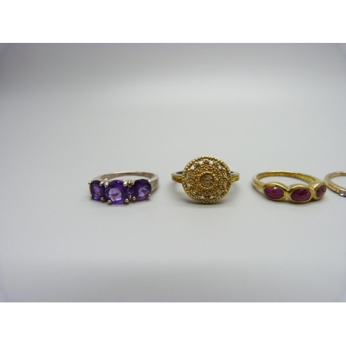 1031 - Three silver rings including one set with diamonds and a costume ring