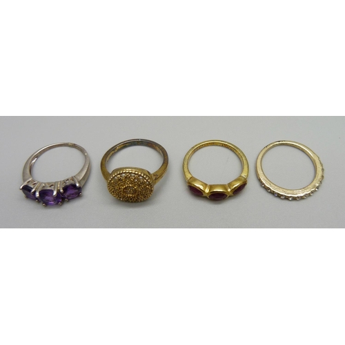 1031 - Three silver rings including one set with diamonds and a costume ring