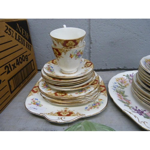 1069 - A Paragon Country Lane six setting tea service, a Windsor tea service, lacking sugar bowl, and a gre... 