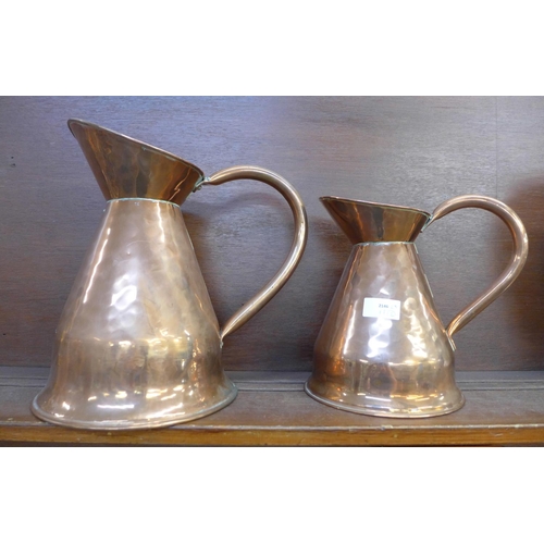 605 - Two large copper jugs