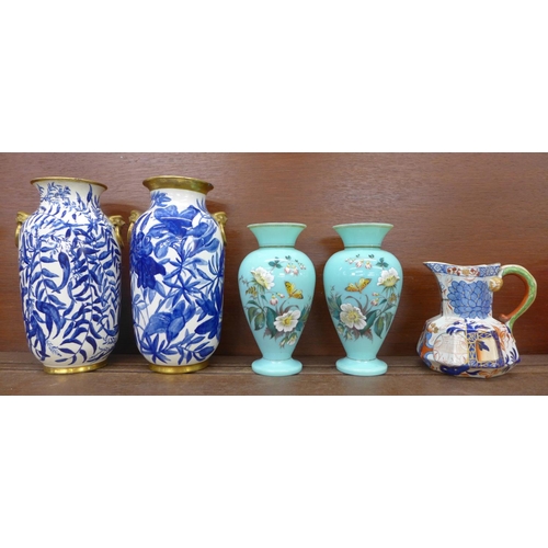 614 - A pair of glass vases decorated with flowers and butterflies, a Davenport jug and two similar blue a... 