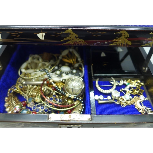 619 - A Japanese hand painted and abalone jewellery box with assorted costume jewellery
