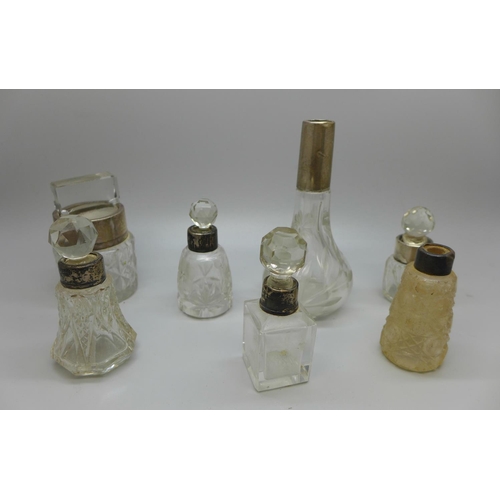 620 - Silver mounted scent bottles, some a/f