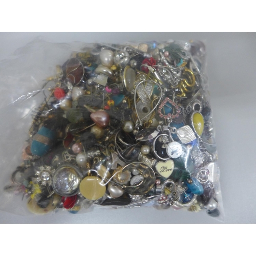 627 - A collection of earrings, beads, etc.