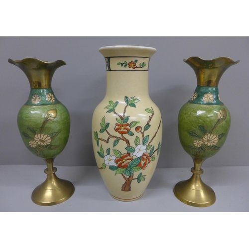630 - An oriental vase and a pair of vases
