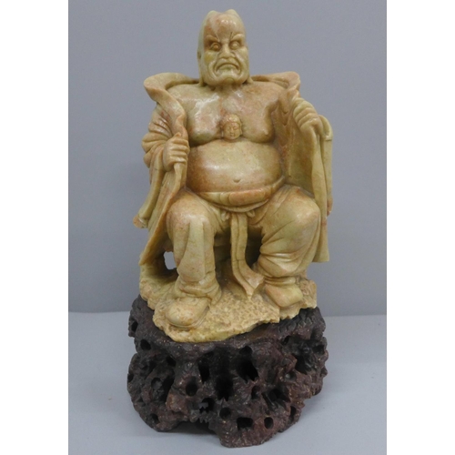 637 - A carved soapstone figure, 20.5cm