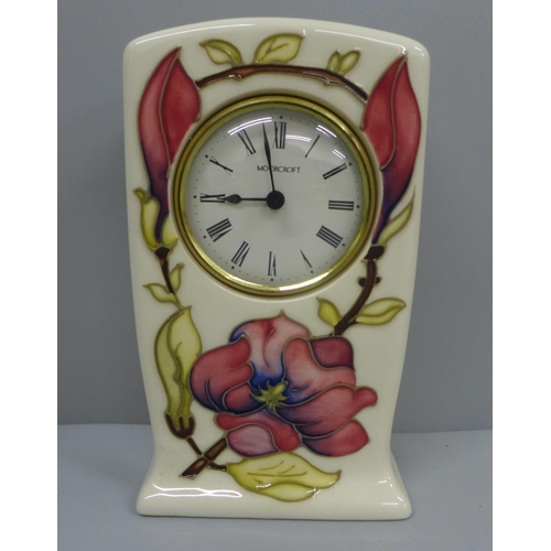 639 - A Moorcroft mantel clock, 15cm
