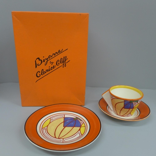 642 - A Wedgwood Clarice Cliff trio, signed by the artist, boxed