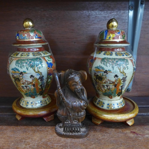 654 - Two Chinese jars on stands and a carved figure, figure 10cm