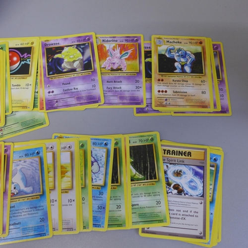 655 - 100 Pokemon cards, including holographic and two Pokeball tins