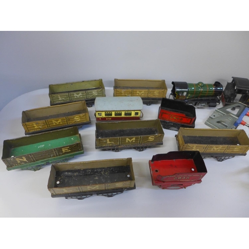 660 - A collection of Hornby 0 gauge wagons, a locomotive and carriages
