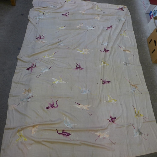 662 - A large silk embroidered shawl decorated with cranes, a/f, (96 x 56 inches)