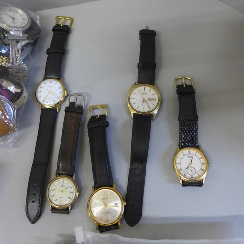 668 - A collection of lady's and gentleman's wristwatches and straps