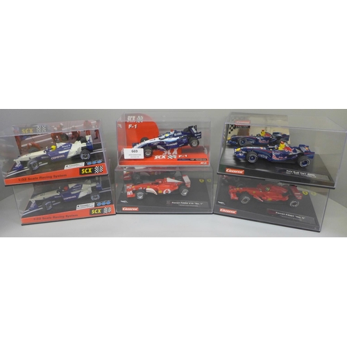 669 - Six Formula 1 model racing cars, three SCX and three Carrera, boxed