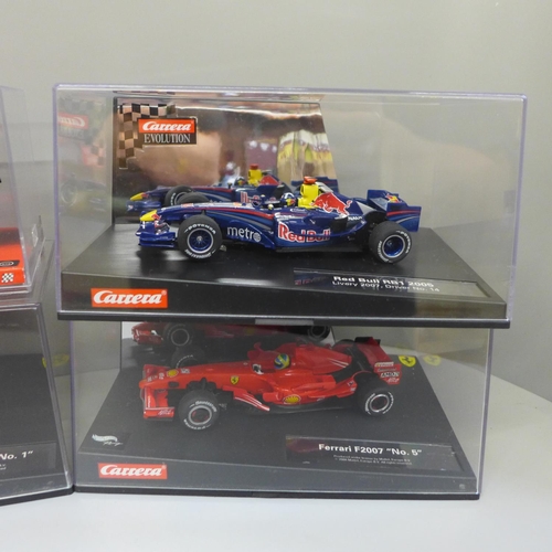 669 - Six Formula 1 model racing cars, three SCX and three Carrera, boxed