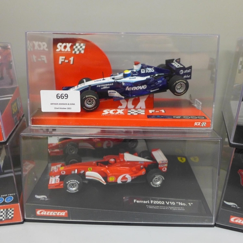 669 - Six Formula 1 model racing cars, three SCX and three Carrera, boxed