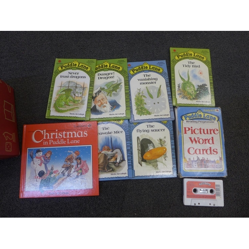 670 - A collection of 55 Ladybird Puddle Lane books, six with names written in, including picture word car... 