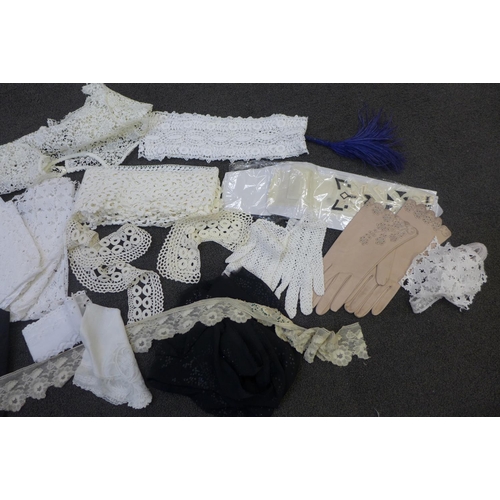 676 - A box of assorted lace and crochet work, etc., including a pair of crochet gloves, and a pair of lea... 